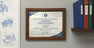 Framed NAASE Certified Sales Engineer diploma hanging on a wall next to engineering blueprints and binder files